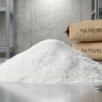 Mound of industrial grade white Polyvinyl Alcohol PVA powder for concrete adhesion and waterproofing applications