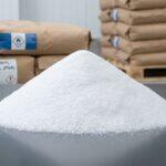 Heap of industrial grade white Polyvinyl Alcohol (PVA) powder for adhesive and construction applications